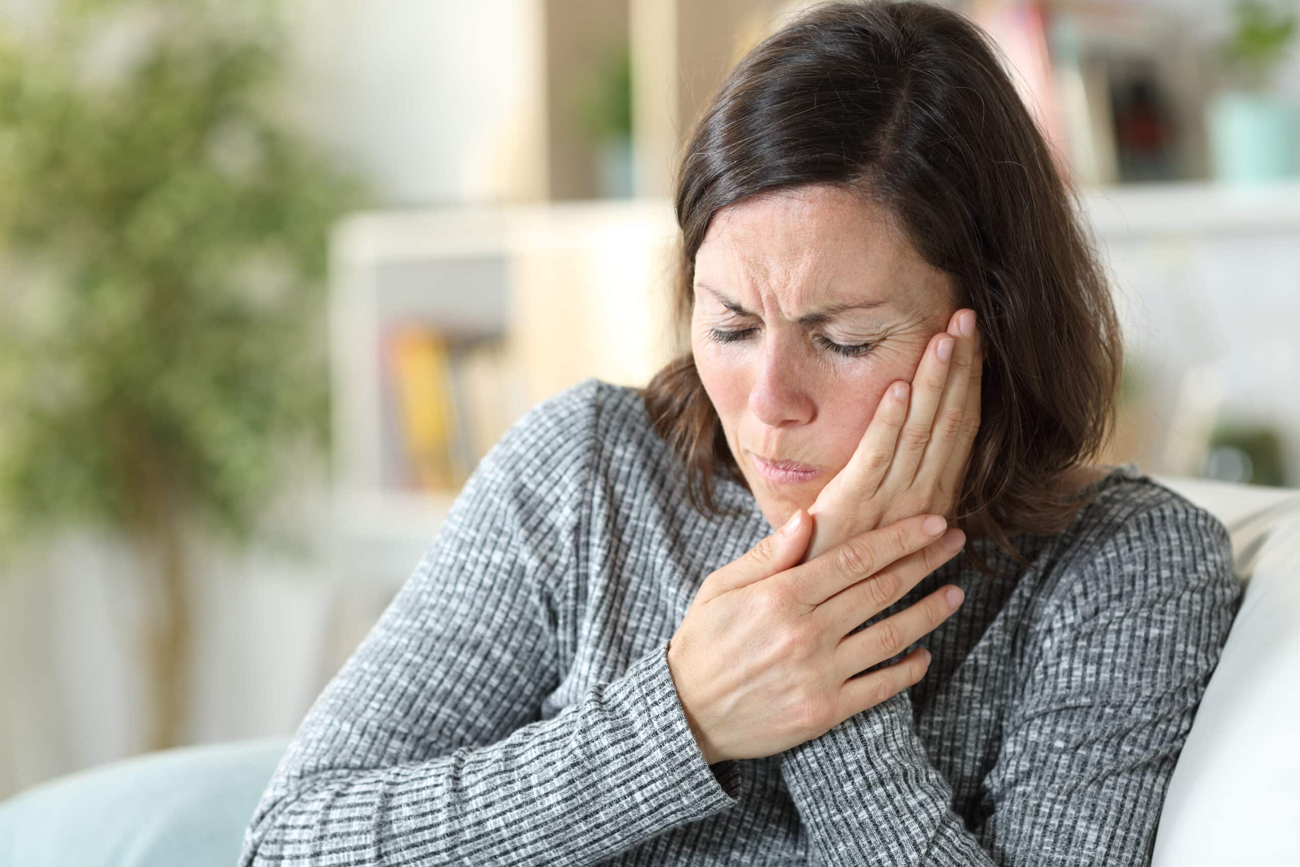 Middle,Age,Woman,In,Pain,Suffering,Toothache,Touching,Face,Sitting